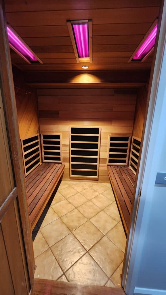 Technician testing a custom sauna heater connection