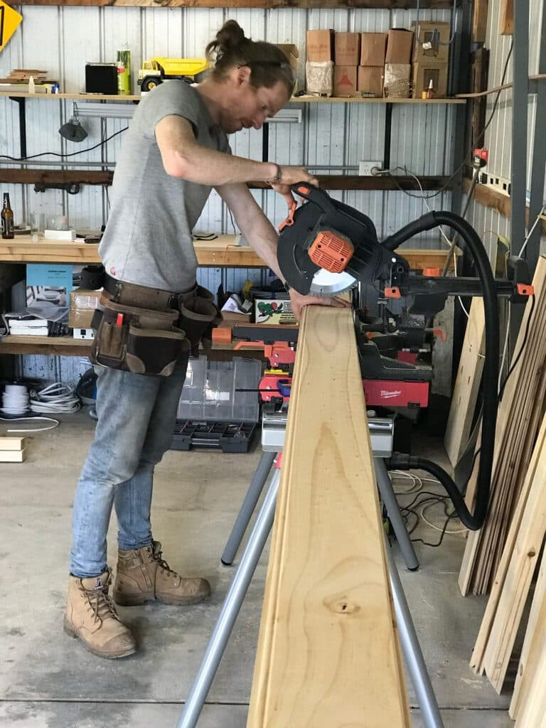 SaunaCloud craftsman cutting Western Red Cedar in the workshop